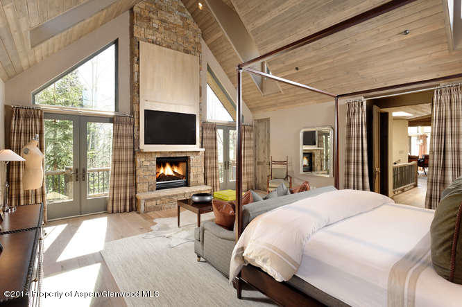1240 Riverside Drive Aspen, CO 81611 - Photo 8 of 17 a large bedroom with a large bed and a large window