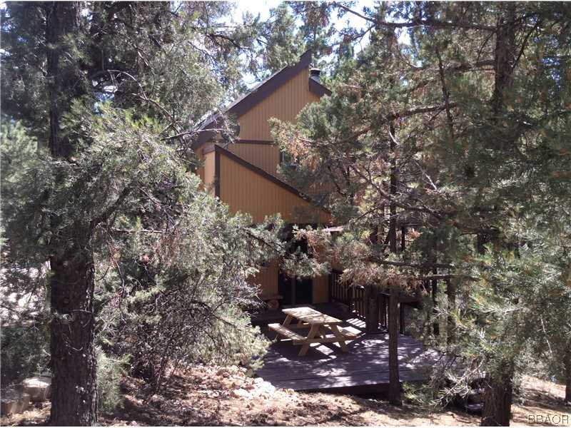 168 Riverside Avenue Sugarloaf, CA 92386 - Photo 19 of 23 a view of a house with a tree