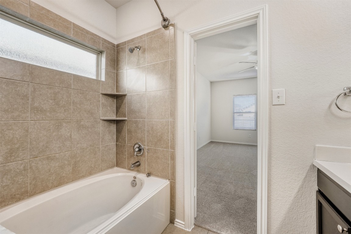 433 Druse Lane Jarrell, TX 76537 - Photo 17 of 28 Full bath with vanity, shower / bath combination, and light carpet