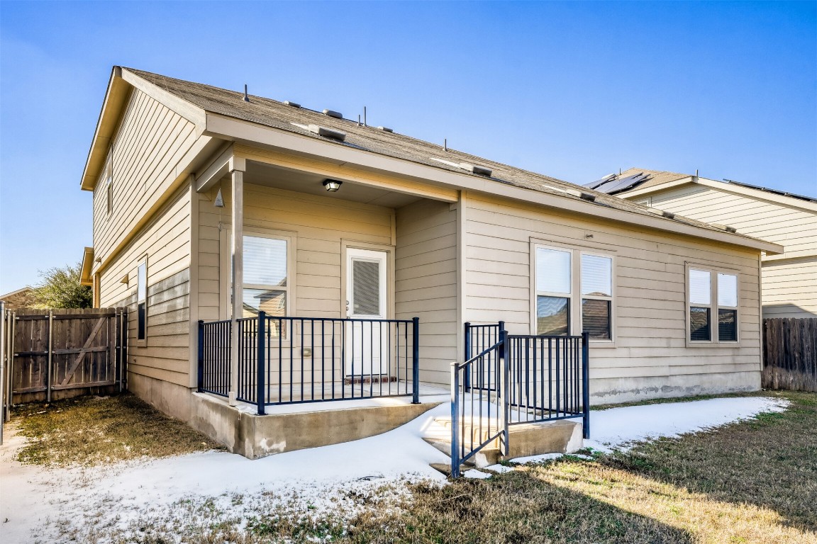 433 Druse Lane Jarrell, TX 76537 - Photo 27 of 28 Back of house with a fenced backyard, a gate, and a patio area