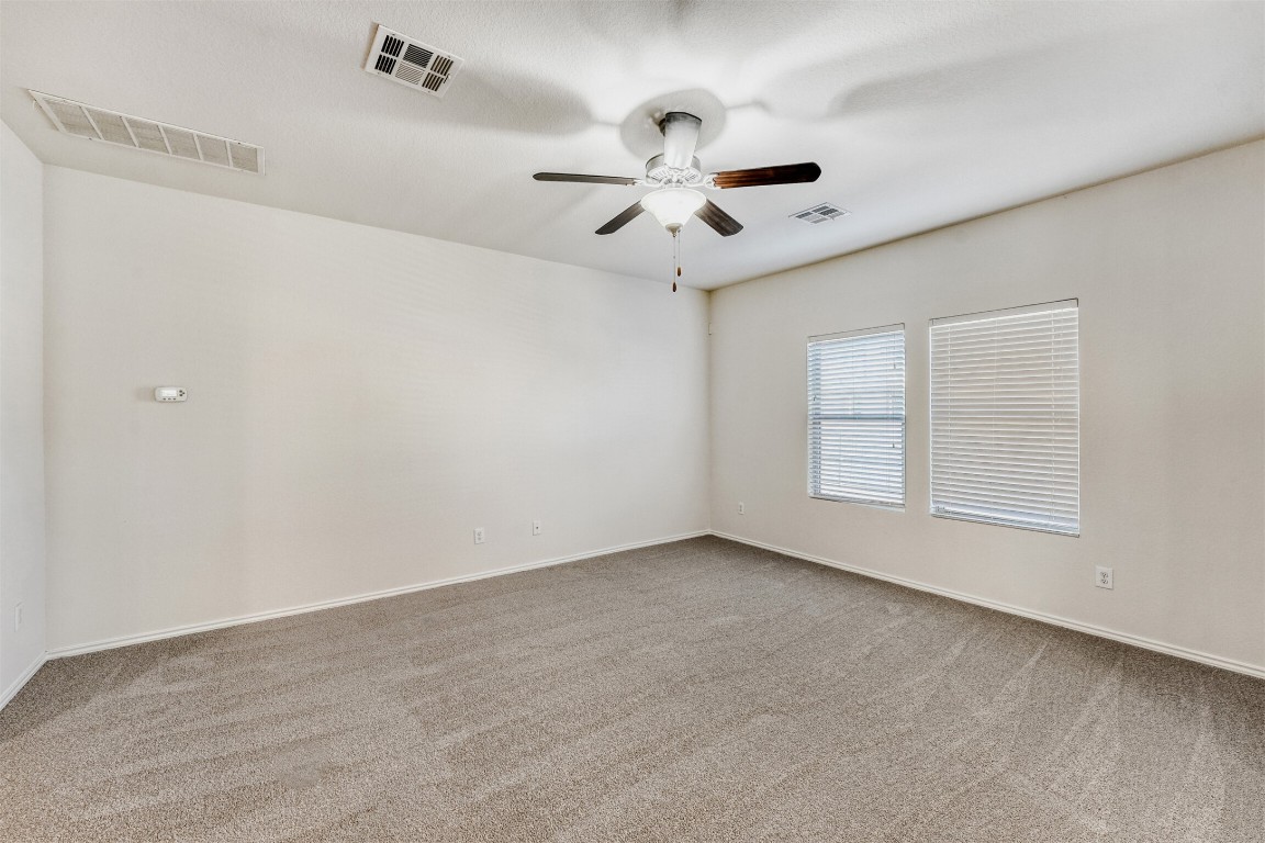 433 Druse Lane Jarrell, TX 76537 - Photo 5 of 28 Spare room with light colored carpet and ceiling fan