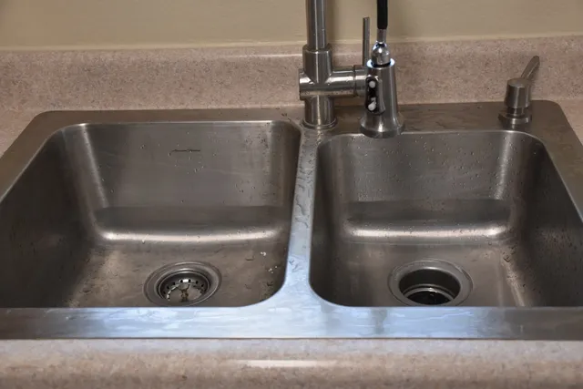a stove top oven sitting inside of a kitchen