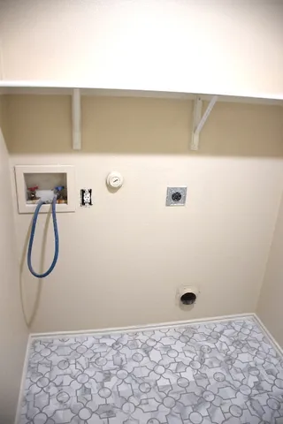 a view of a bathroom from a hallway