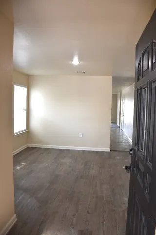 a view of an empty room and a windows