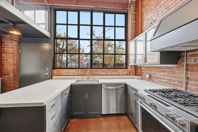 a kitchen with a stove and a sink