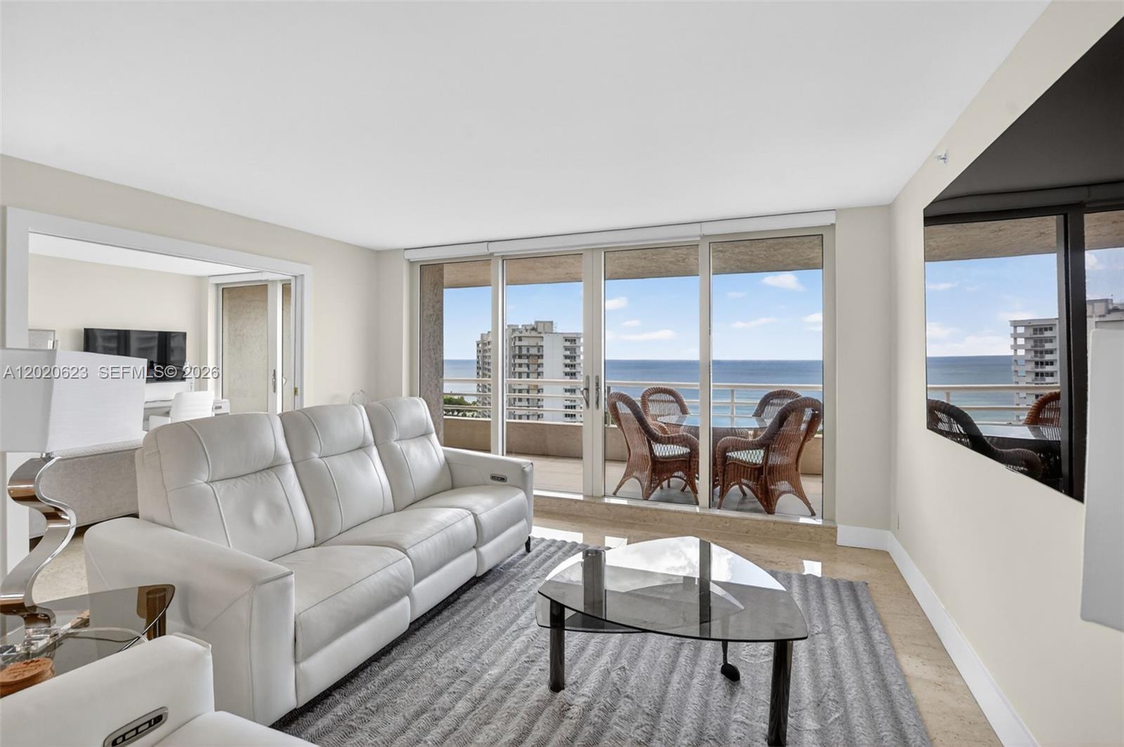 4101 North Ocean Boulevard, Unit 1605 Boca Raton, FL 33431 - Photo 13 of 35 a living room with furniture and a large window