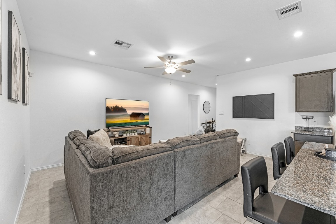 7534 Cynomys Court Rosharon, TX 77583 - Photo 12 of 35 a living room with furniture and a flat screen tv