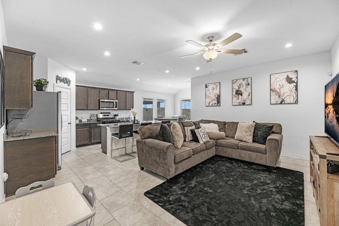7534 Cynomys Court Rosharon, TX 77583 - Photo 5 of 35 a living room with furniture kitchen view and a chandelier