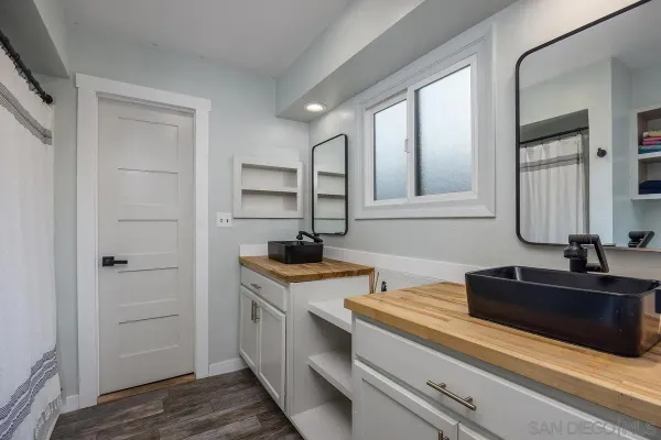 a kitchen with a sink and cabinets