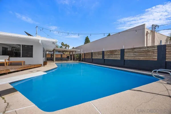 a view of a backyard with seating area