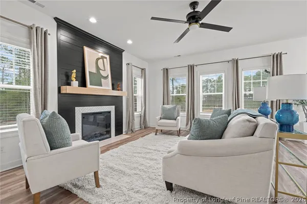 a living room with furniture and a fireplace