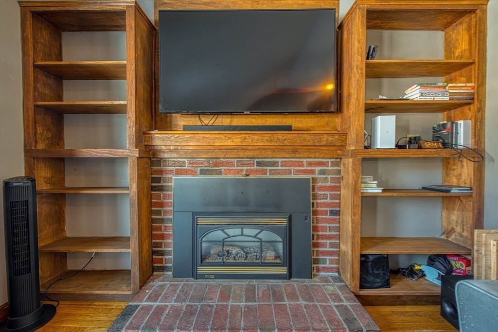 12 Brewster Road Randolph, MA 02368 - Photo 19 of 27 a living room with a fireplace