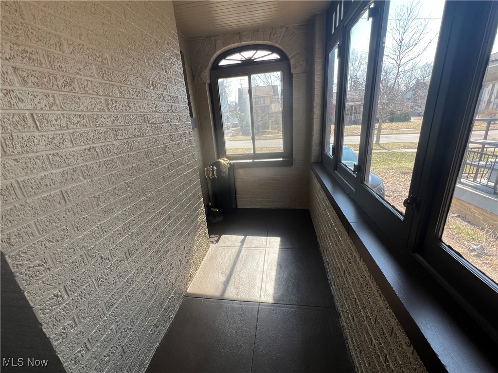 3505 Silsby Road Cleveland, OH 44118 - Photo 25 of 34 Unfurnished sunroom with radiator heating unit and a healthy amount of sunlight