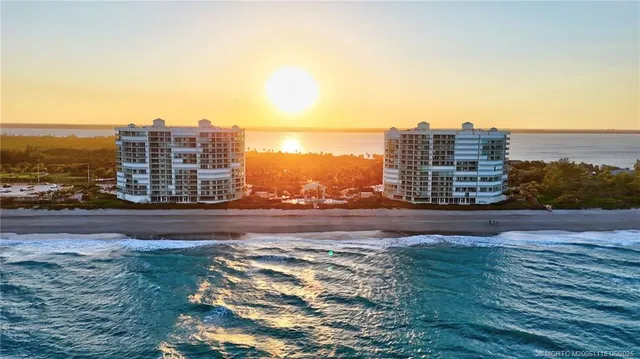 a view of a building with mountains in the background