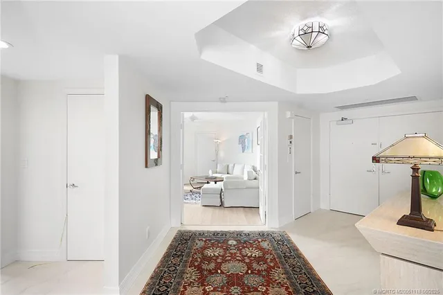 a bathroom with a shower and a glass door
