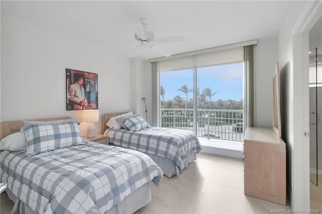 a spacious bathroom with a granite countertop sink mirror and a