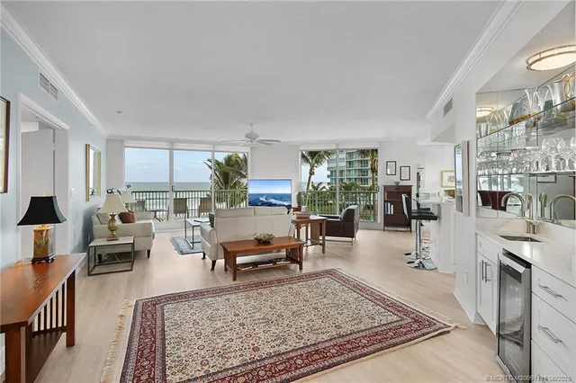 a living room with furniture flat screen tv and a fireplace