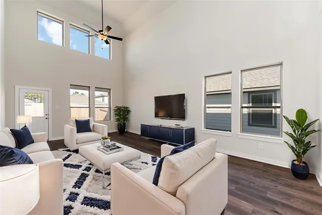 a living room with furniture and a flat screen tv