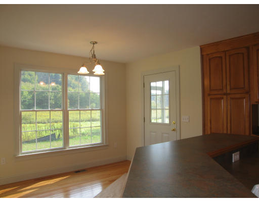 15 Macomber Road Monson, MA 01057 - Photo 11 of 16 a view of an empty room with wooden floor and a window