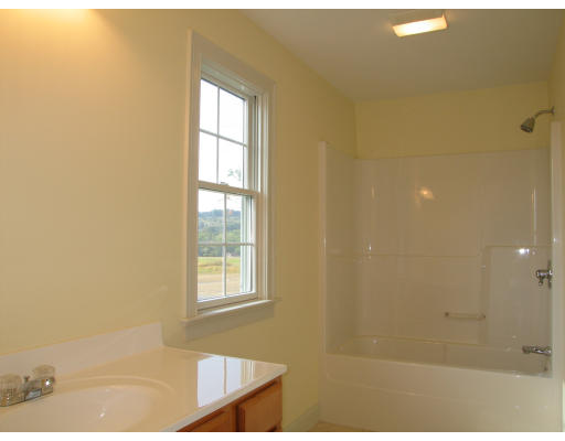 15 Macomber Road Monson, MA 01057 - Photo 13 of 16 a bathroom with a window