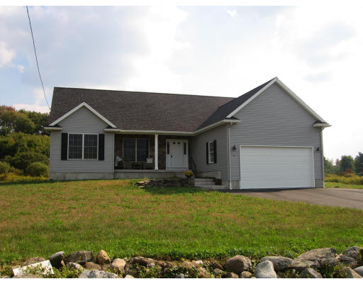 15 Macomber Road Monson, MA 01057 - Photo 16 of 16 a front view of house with yard and garage