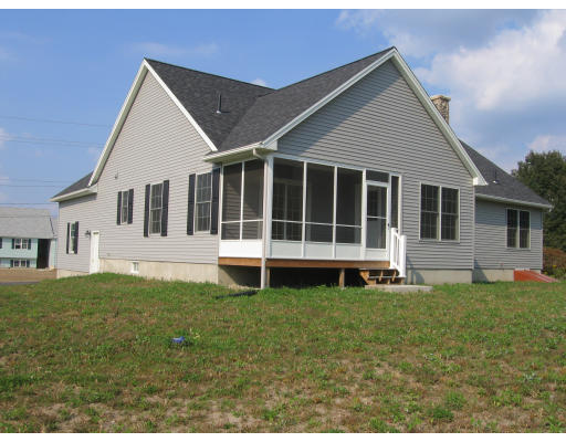 15 Macomber Road Monson, MA 01057 - Photo 2 of 16 a house that has a big yard in front of it