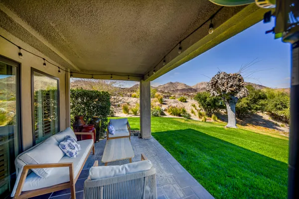 a view of a patio with garden