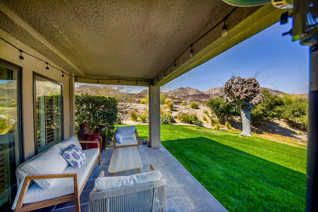 a view of a patio with garden