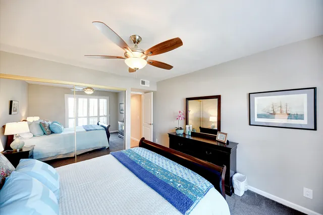 a bed room with furniture and a window