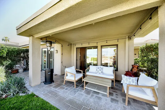 a outdoor living space with furniture and garden view