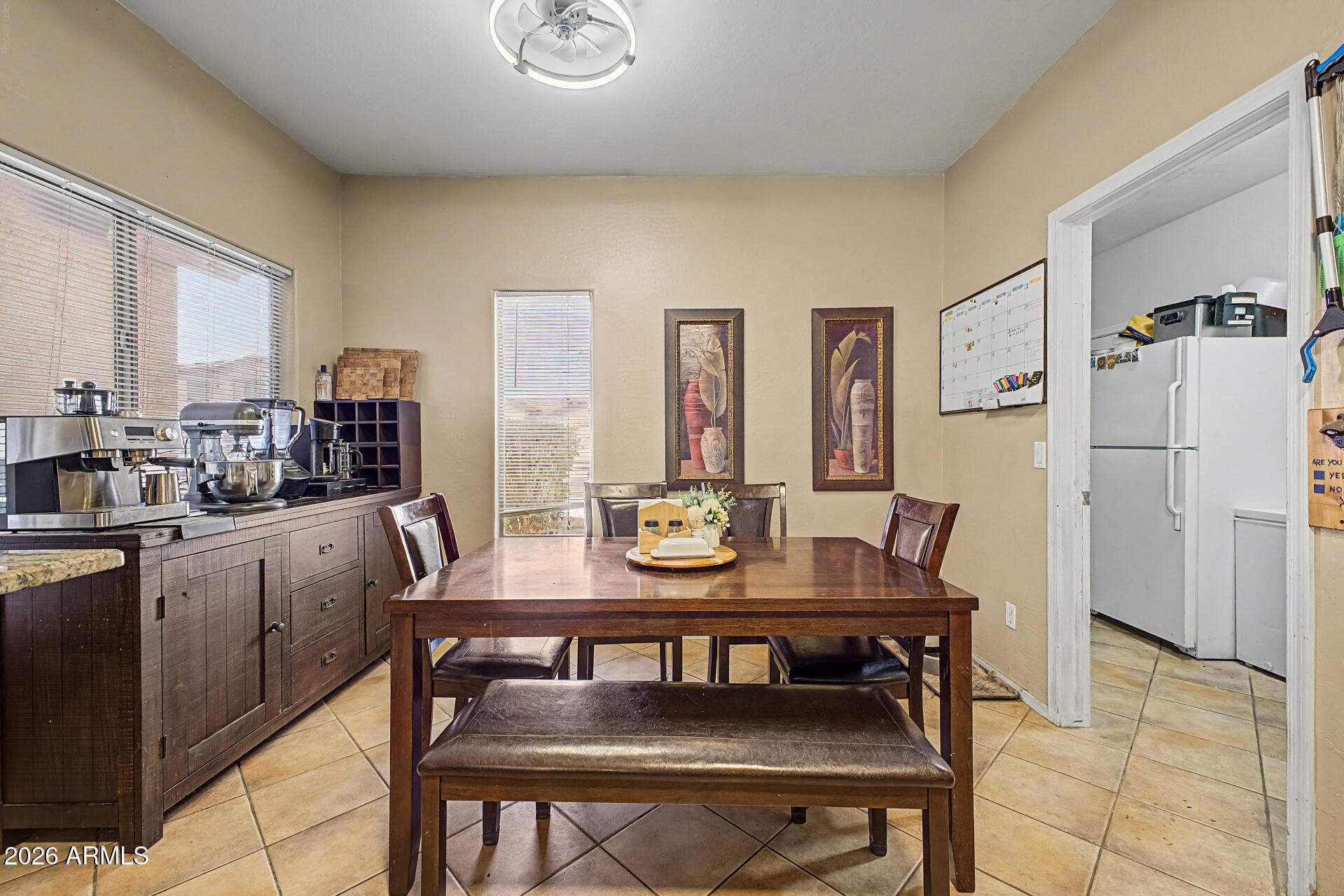 5301 West Grenadine Road Laveen, AZ 85339 - Photo 10 of 37 a view of a dining room with furniture