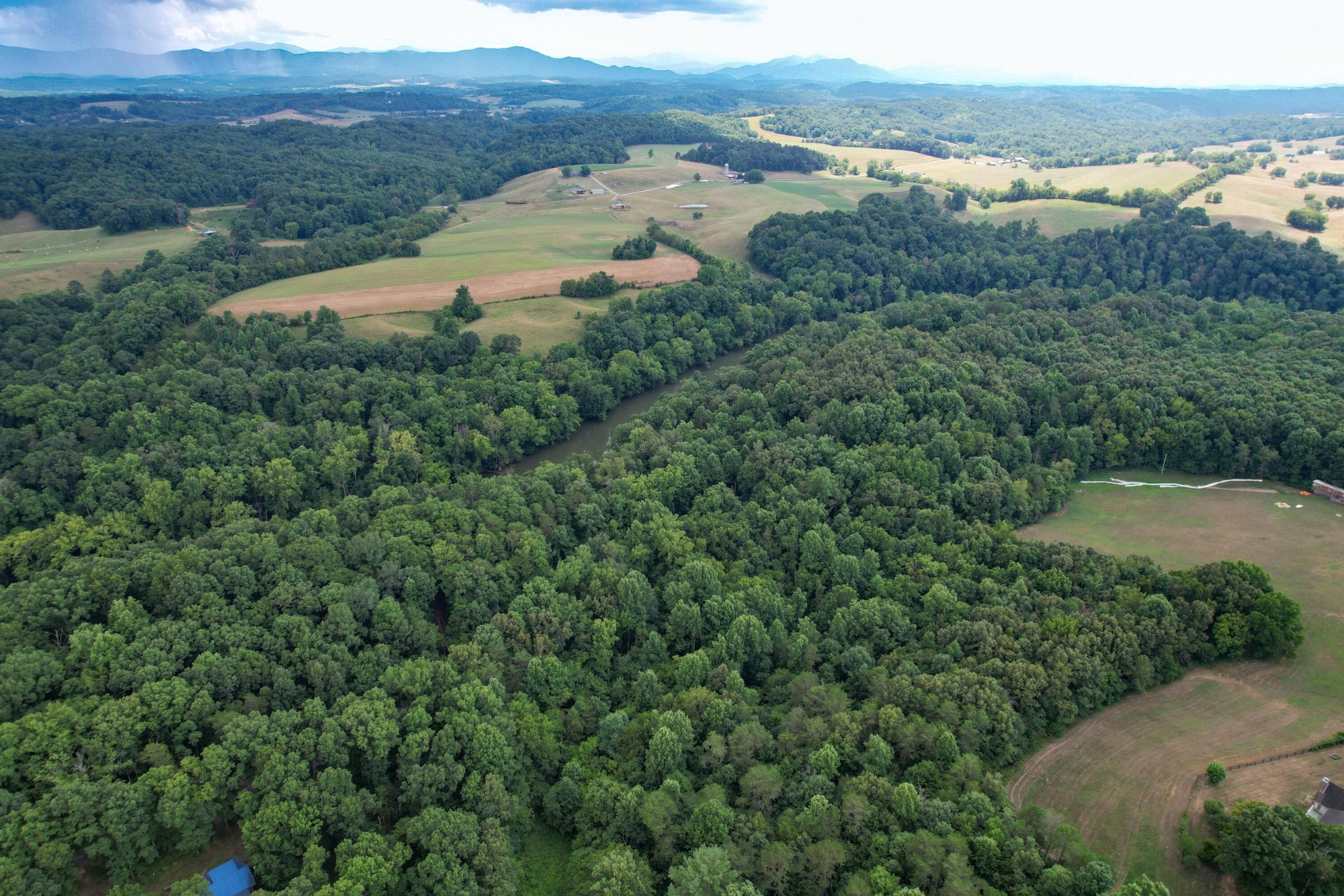 1 Pates Hill Road Mosheim, TN 37818 - Photo 9 of 22 a view of a lake with a mountain