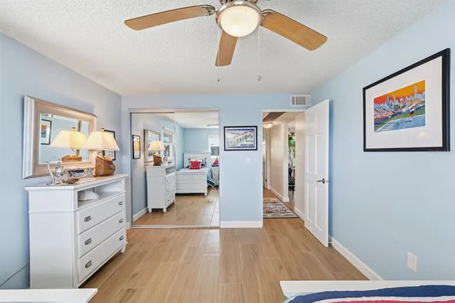 a spacious bathroom with a double vanity sink mirror and shower