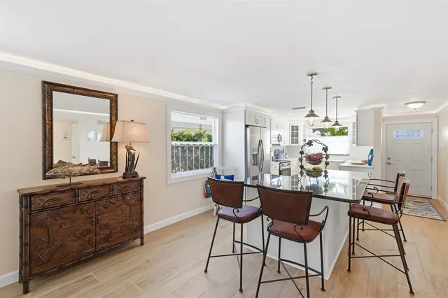 a dining room with furniture and window