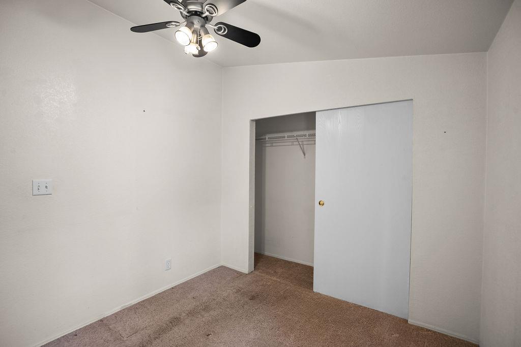 1281 Pleasant Valley Road, Unit 44 Diamond Springs, CA 95619 - Photo 18 of 29 a view of an empty room with a ceiling fan