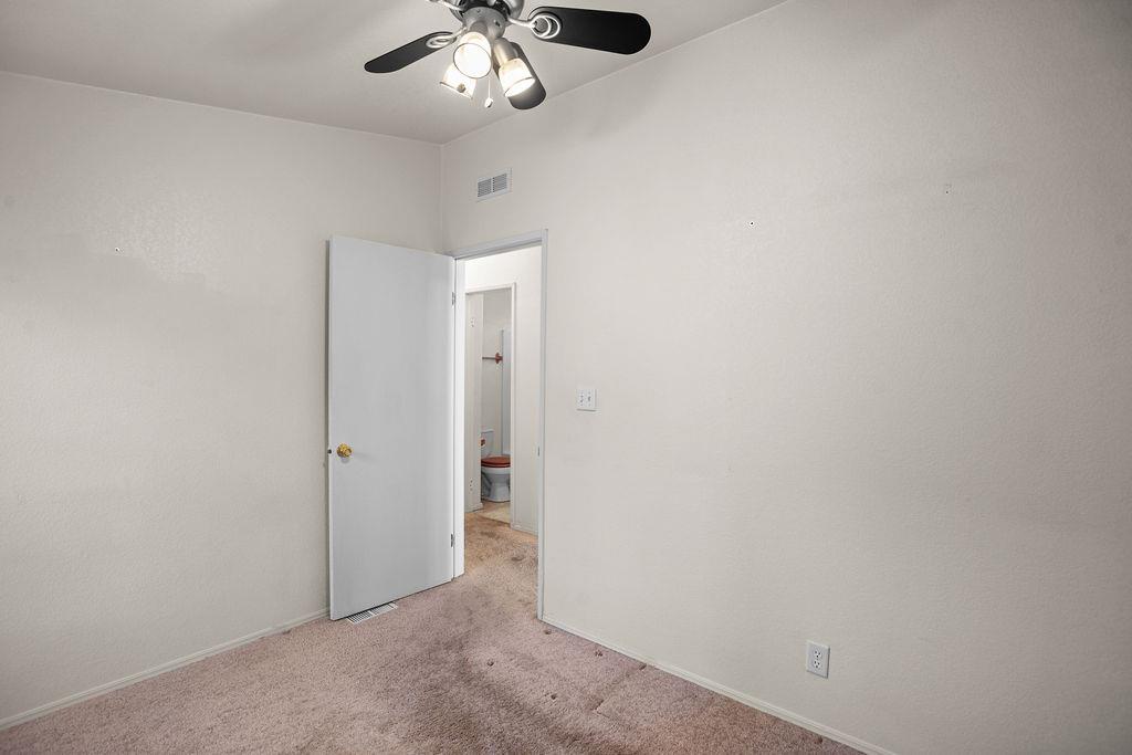 1281 Pleasant Valley Road, Unit 44 Diamond Springs, CA 95619 - Photo 19 of 29 an empty room with a chandelier fan