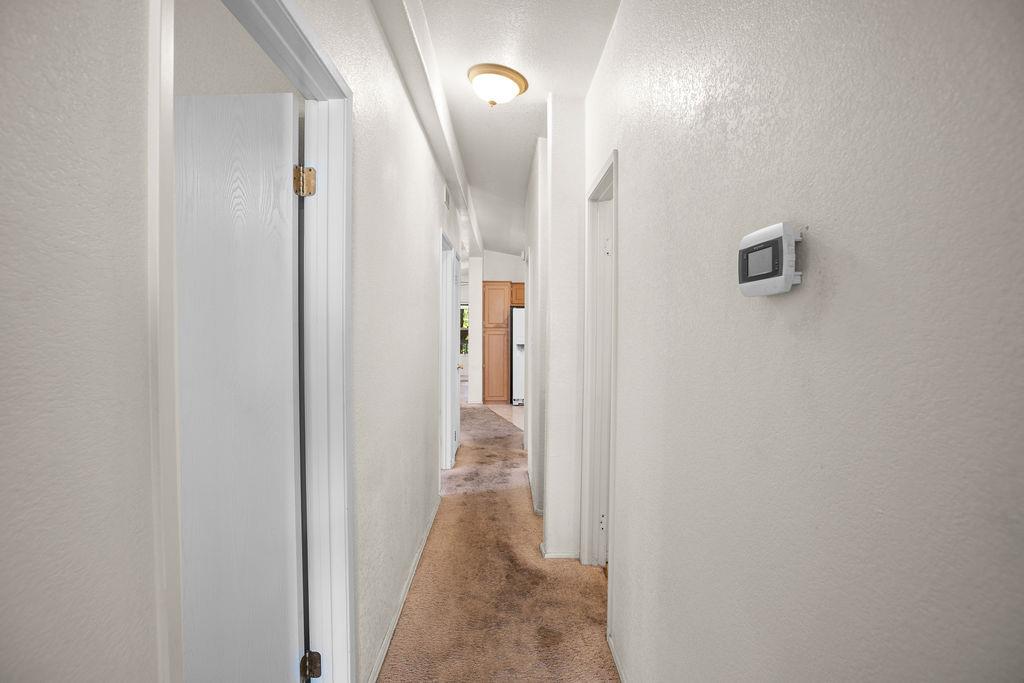 1281 Pleasant Valley Road, Unit 44 Diamond Springs, CA 95619 - Photo 21 of 29 a view of a hallway with wooden floor