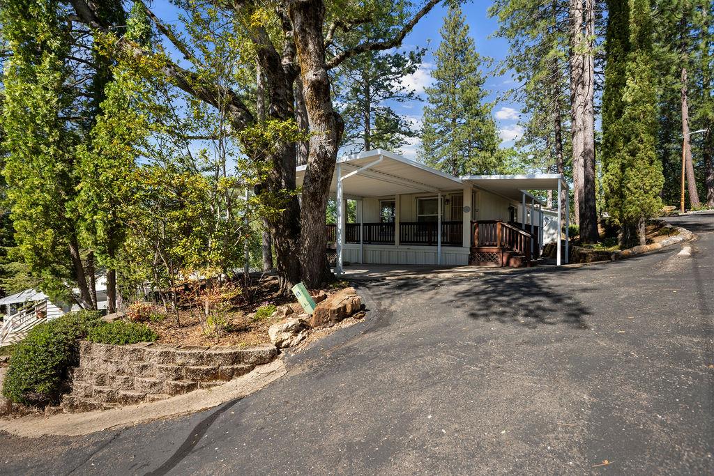 1281 Pleasant Valley Road, Unit 44 Diamond Springs, CA 95619 - Photo 5 of 29 a view of a house with a tree park