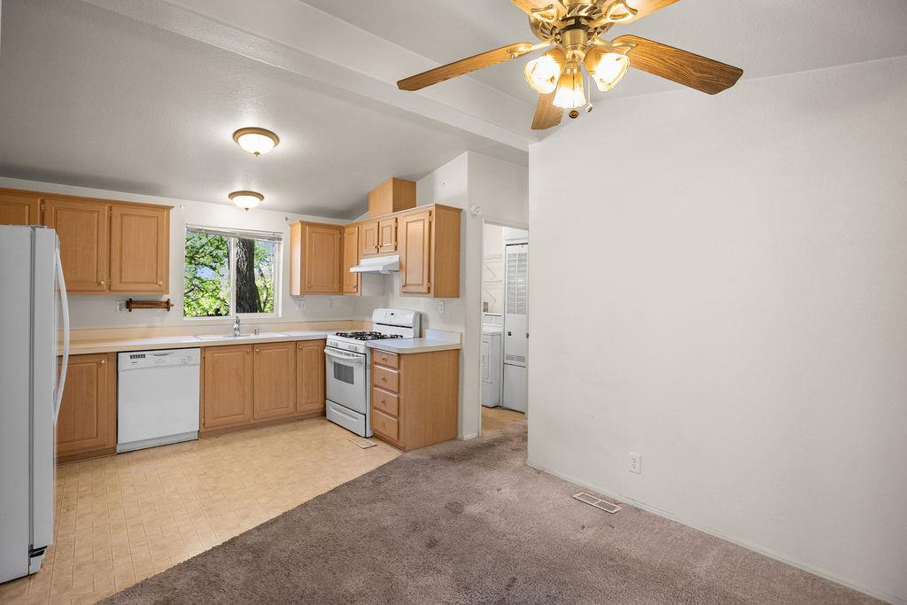 1281 Pleasant Valley Road, Unit 44 Diamond Springs, CA 95619 - Photo 6 of 29 a kitchen with a refrigerator and a sink