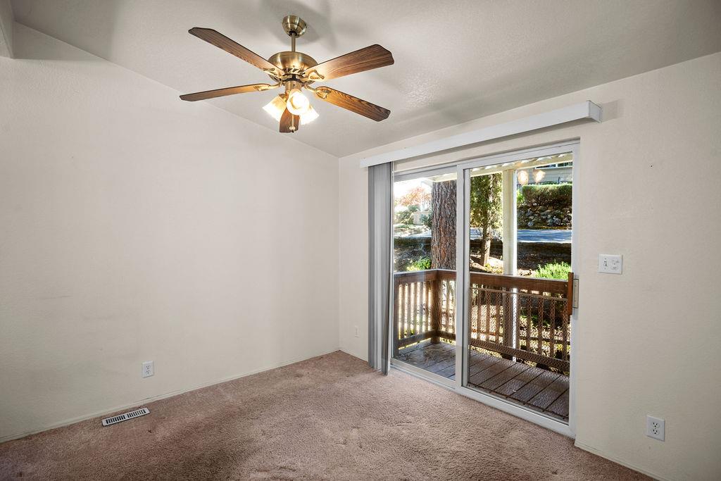 1281 Pleasant Valley Road, Unit 44 Diamond Springs, CA 95619 - Photo 10 of 29 an empty room with chandelier fan