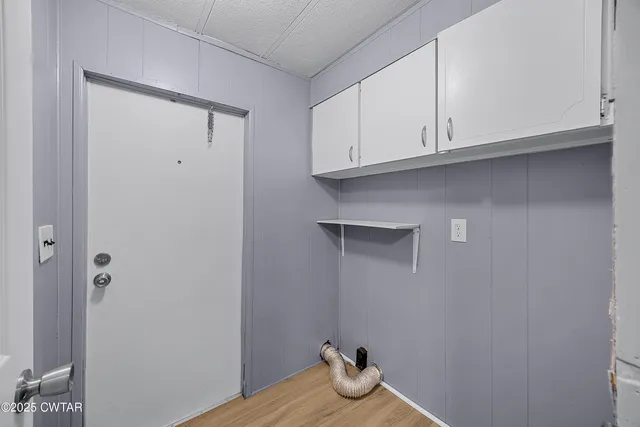 a swimming pool with outdoor seating and yard