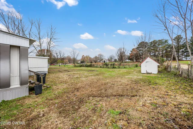a view of a yard with a house
