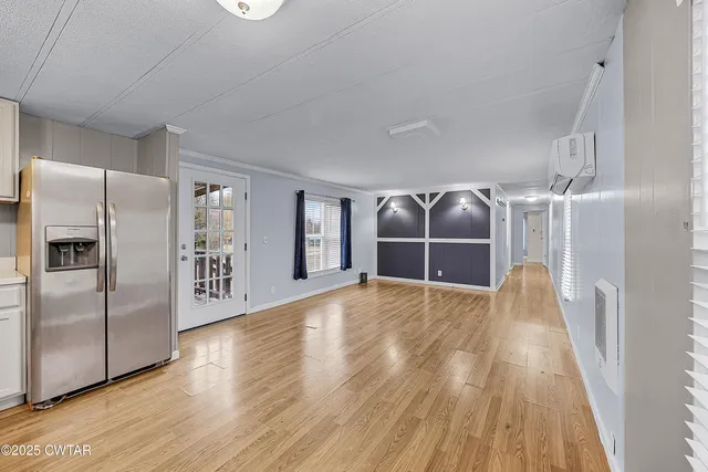 a view of a livingroom with wooden floor