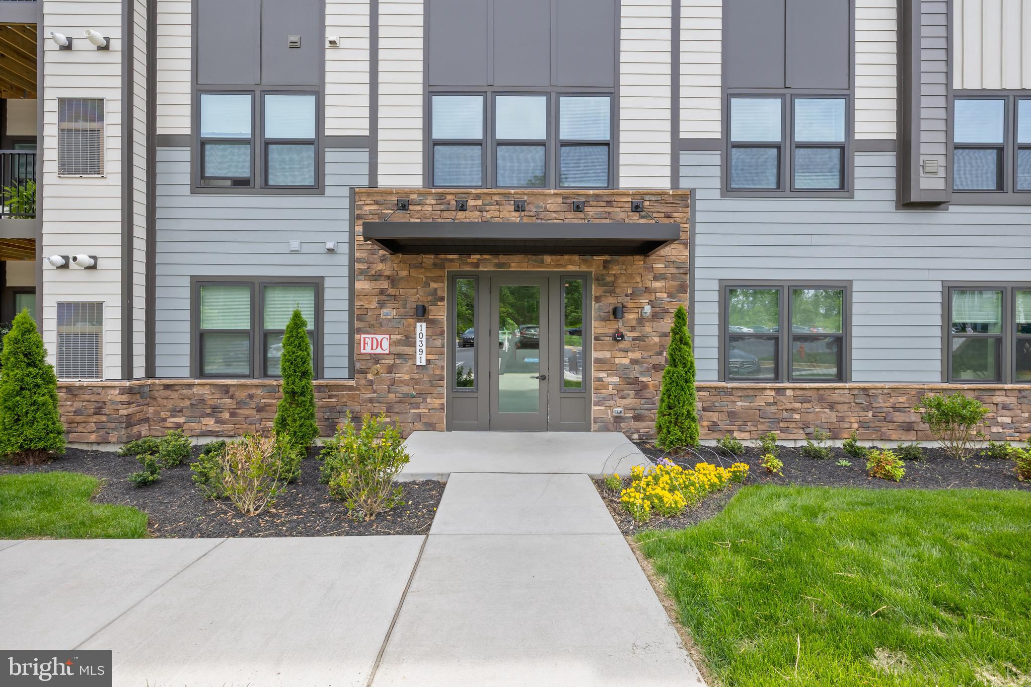 10391 Resort Road, Unit Q Ellicott City, MD 21042 - Photo 2 of 24 a view of a house with a yard