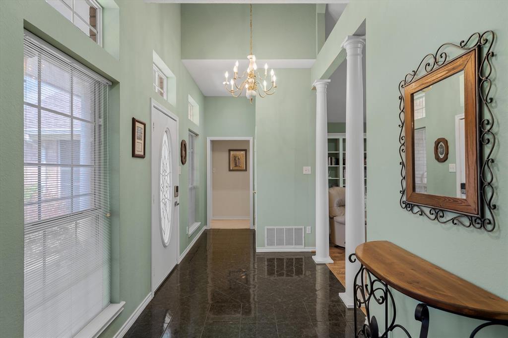 271 VZ County Road Canton, TX 75103 - Photo 7 of 40 a view of a hallway with windows and chandelier