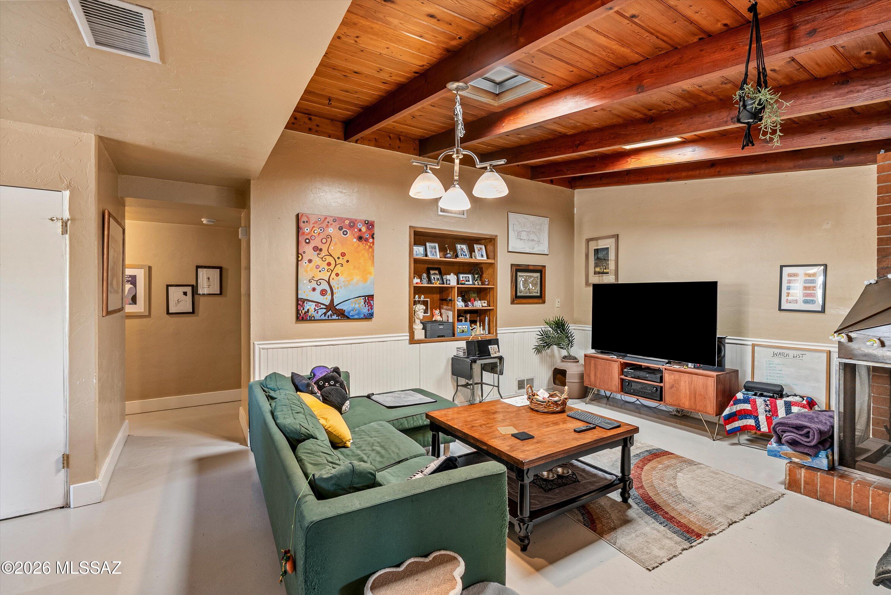 2934 East Exeter Street Tucson, AZ 85716 - Photo 8 of 20 a living room with furniture kitchen view and a flat screen tv