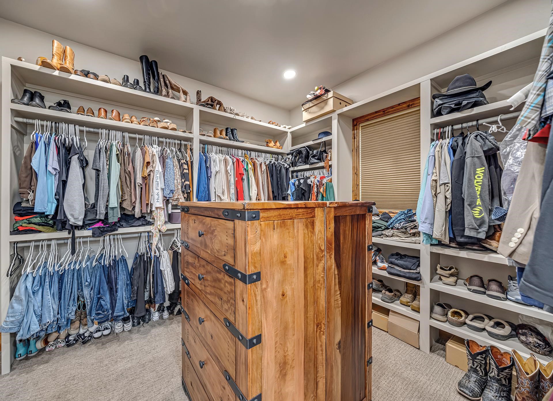 2440 J Road Grand Junction, CO 81505 - Photo 19 of 42 a view of walk in closet with clothes and shoes