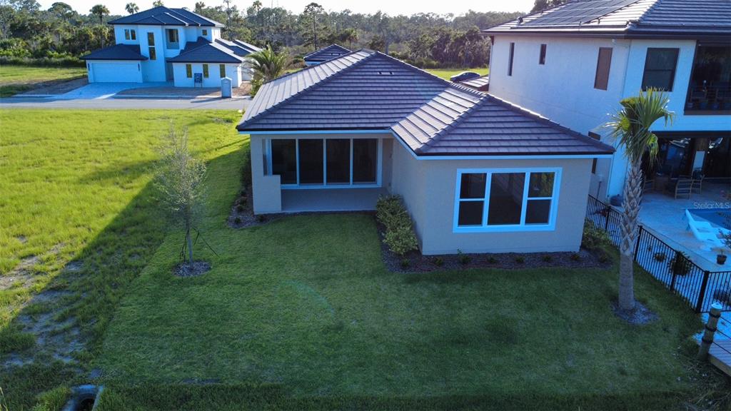 4 Coronado Road Flagler Beach, FL 32136 - Photo 24 of 30 a view of a house with a yard
