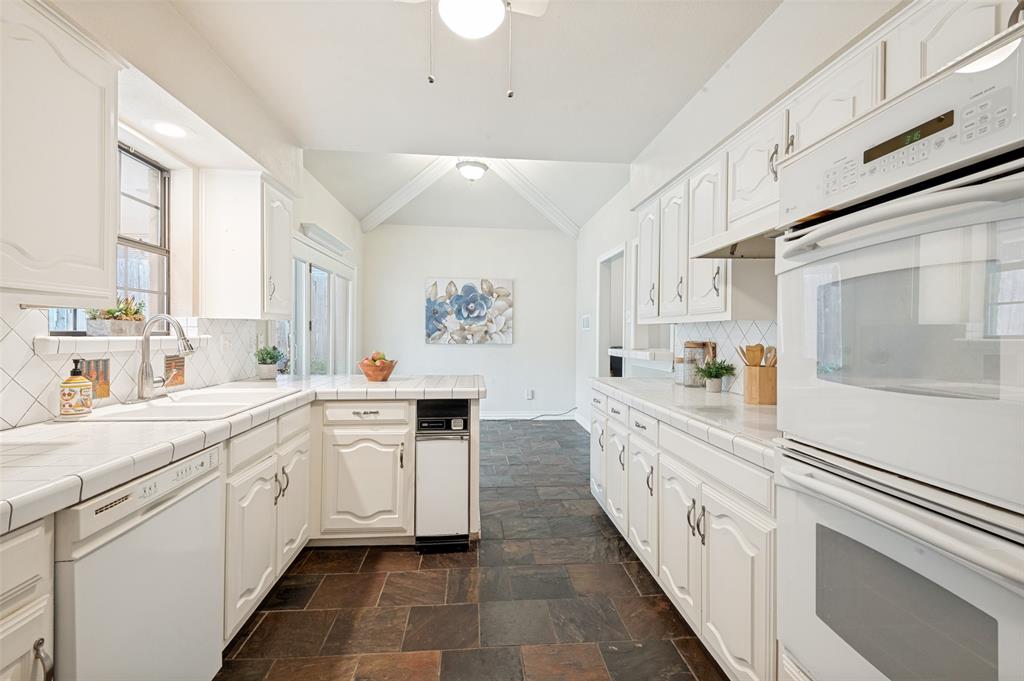 2926 Roaring Springs Road Grapevine, TX 76051 - Photo 9 of 30 Galley kitchen with ample counter space and storage