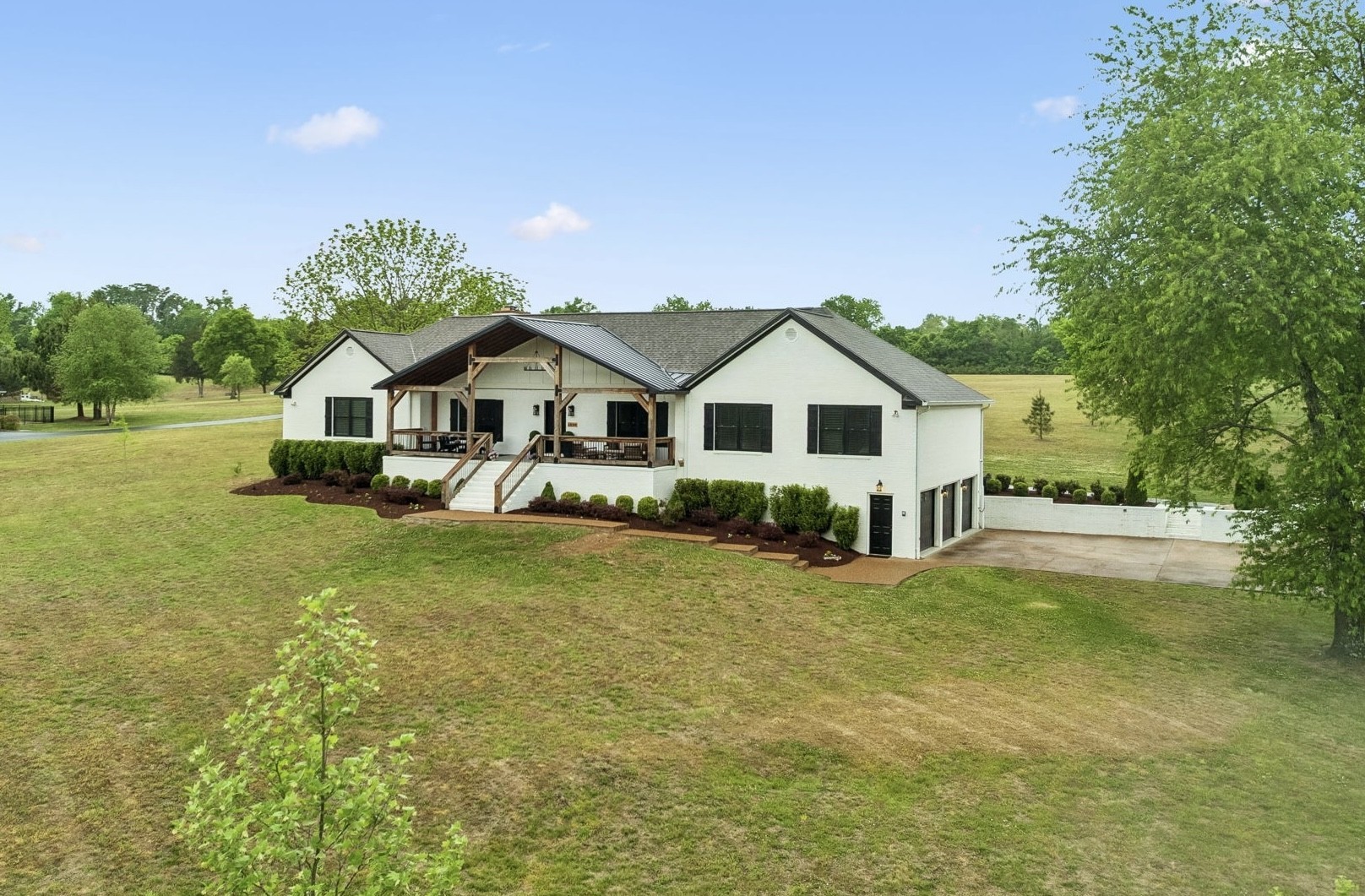 1930 Rock Springs Road Columbia, TN 38401 - Photo 2 of 100 a front view of a house with yard and green space